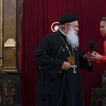 Abouna Makary talks with a visitor, believed to be possessed, during the Coptic Orthodox priest's prayers at St. Mark's Cathedral in Cairo, Egypt.