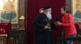 Abouna Makary talks with a visitor, believed to be possessed, during the Coptic Orthodox priest's prayers at St. Mark's Cathedral in Cairo, Egypt.