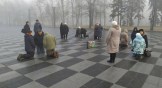 Ukranians praying in the central square of Kharkiv, Ukraine.