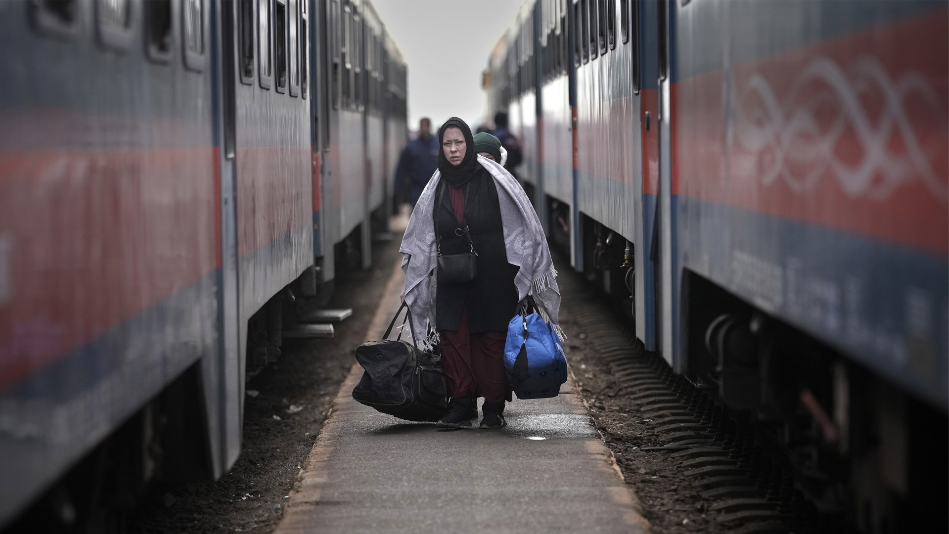 Refugees fleeing Ukraine arrive at the border train station of Zahony, Hungary, on March 8, 2022.