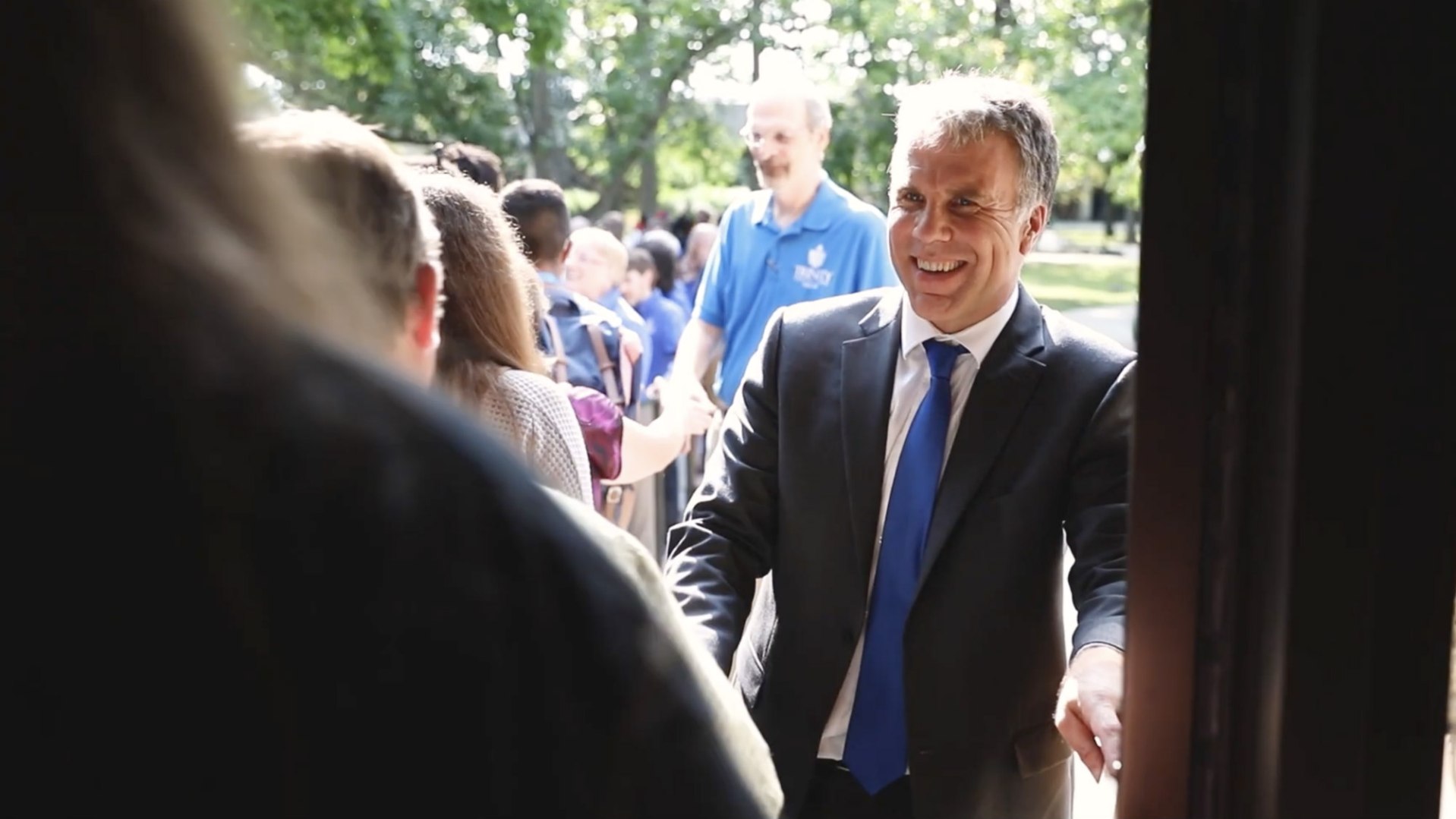 Trinity President Nick Perrin greets students.