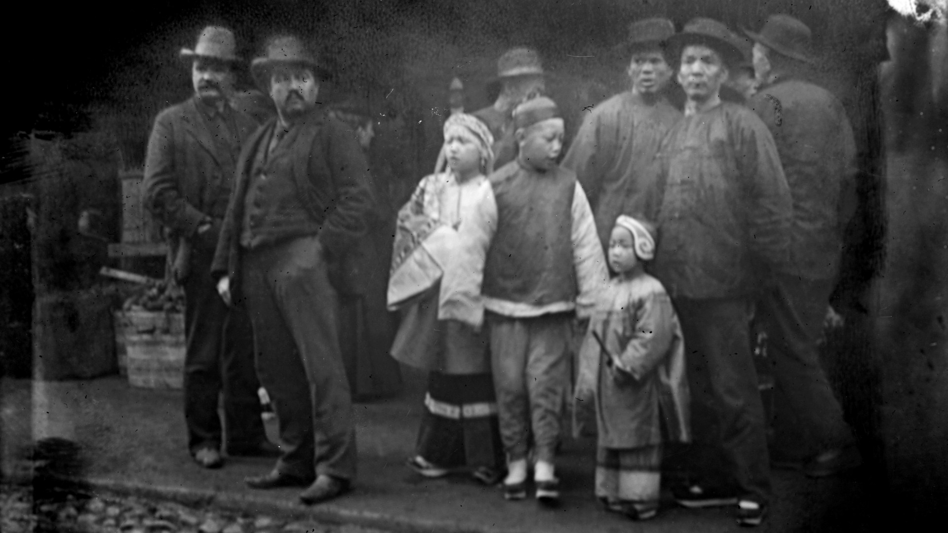 A corner crowd in Chinatown, San Francisco, between 1896 and 1906.
