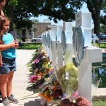 Mourners visit a memorial for a victim's of the mass shooting at an elementary school, in City of Uvalde Town Square.