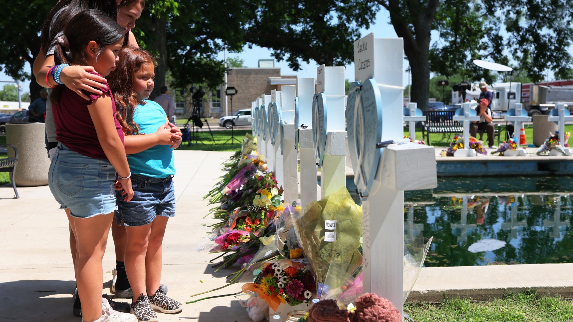 Mourners visit a memorial for a victim's of the mass shooting at an elementary school, in City of Uvalde Town Square.