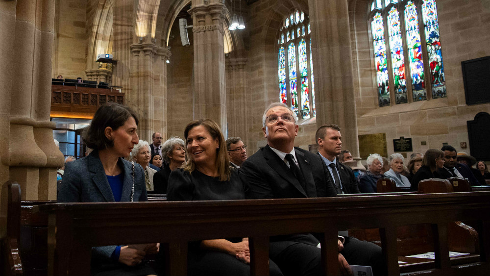 Scott Morrison, center, attends a worship service at an Anglican cathedral in Sydney.