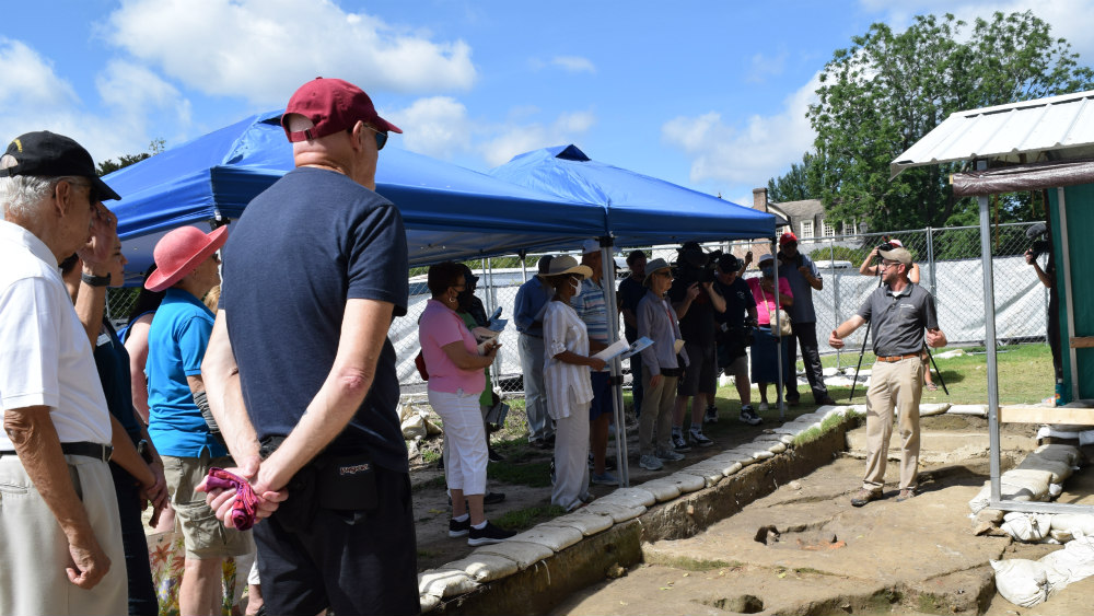 Archaeologist Jack Gary explains the excavation process to descendants of a historic Black Baptist church.