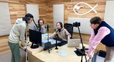 New Life Radio staffers during a broadcast