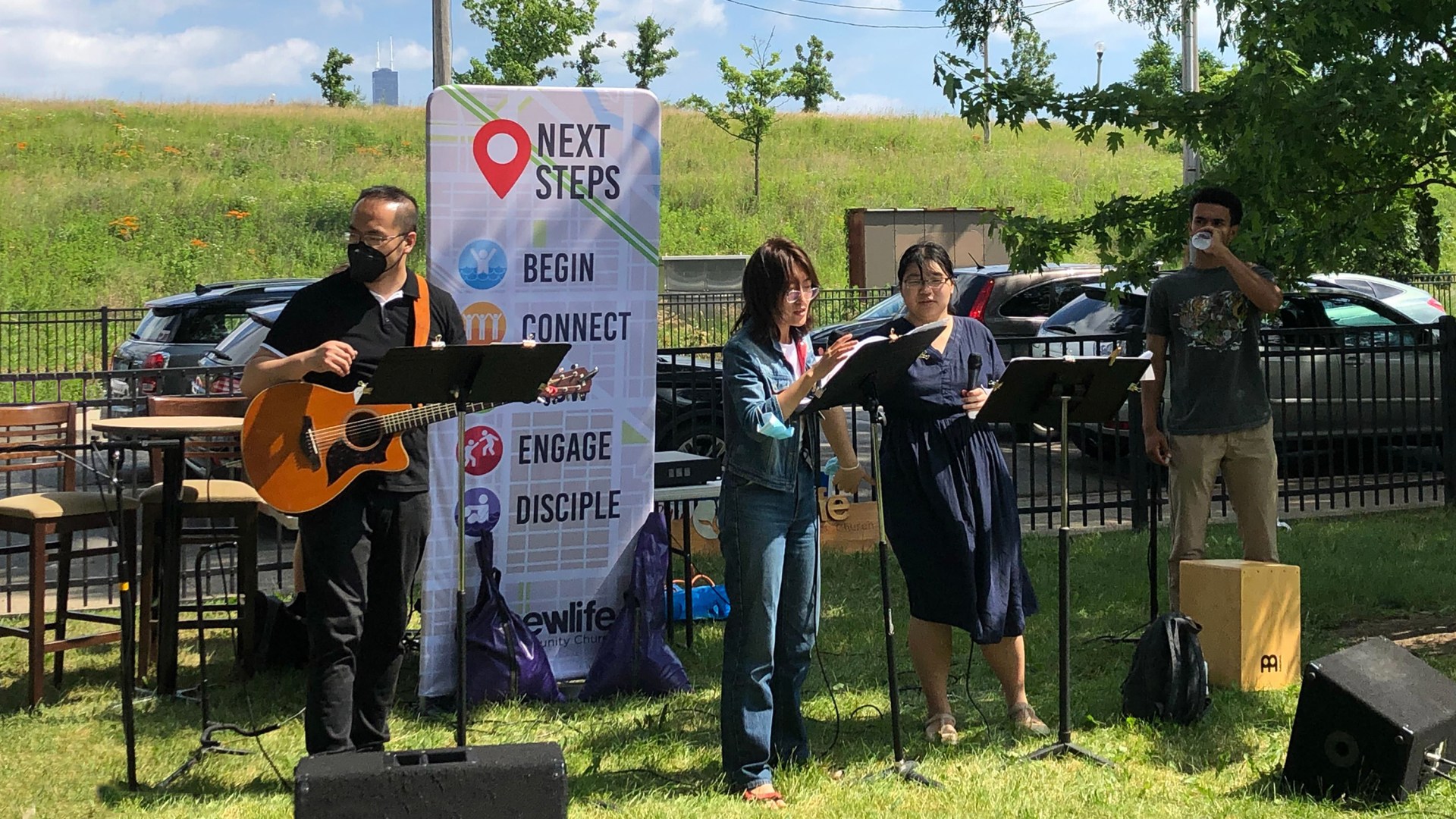 Cui Yu (first from left) and Jane Hao (second from left) leading outdoor Sunday worship of New Life Community Church Bridgeport