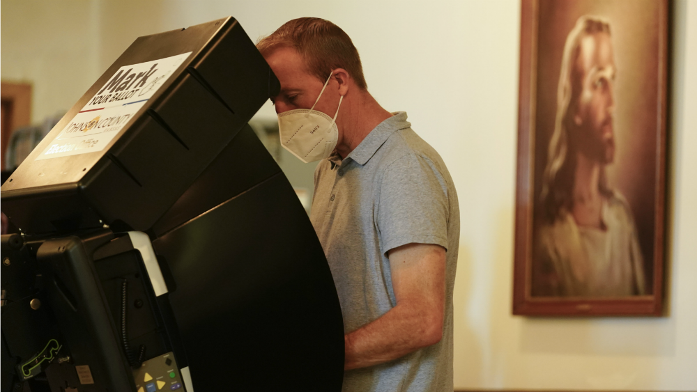 A voter casts his ballot in the Kansas Primary Election at Merriam Christian Church on August 2022 in Merriam, Kansas.