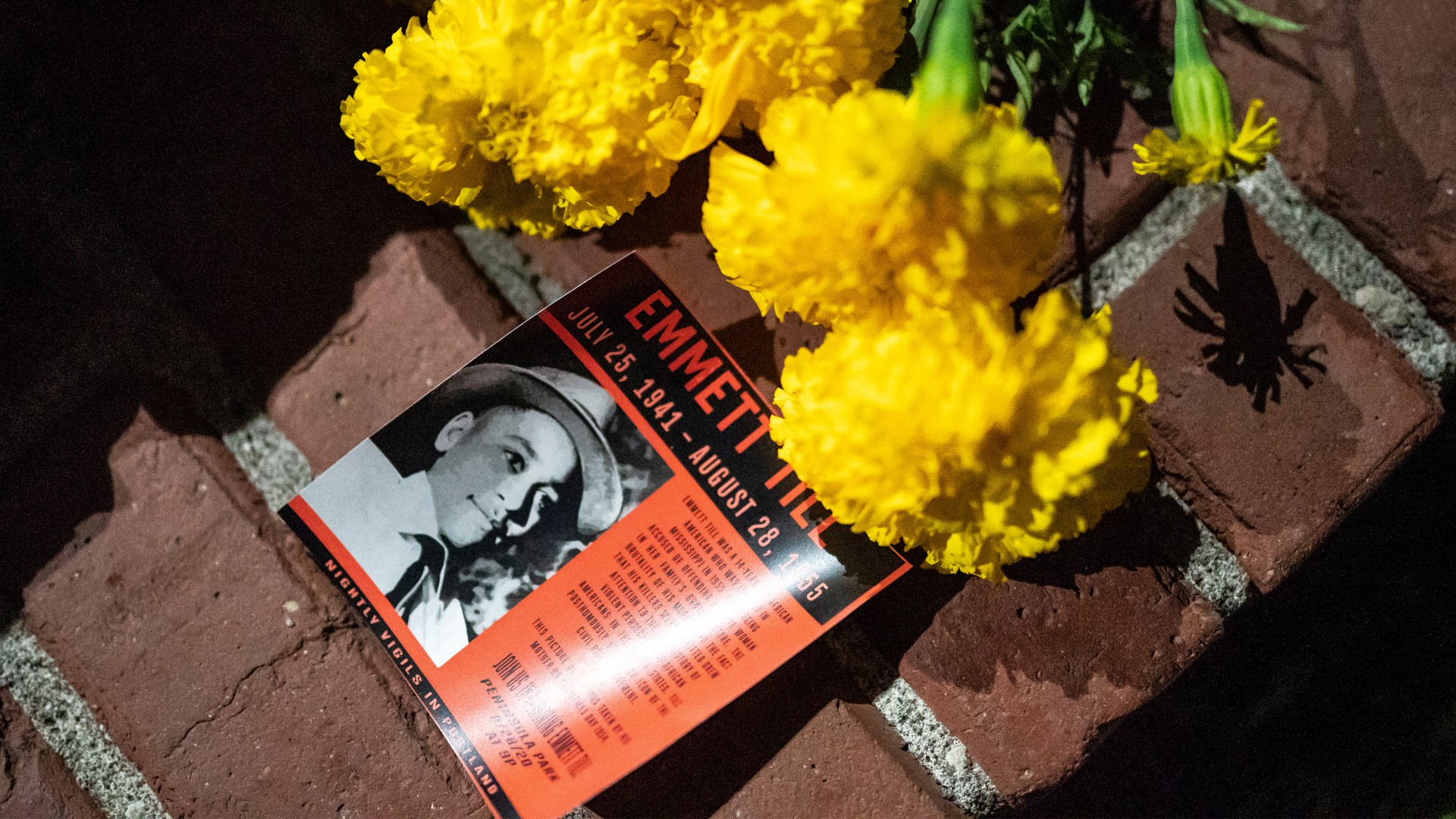 A flyer detailing the lynching of Emmett Till is seen here during a protest against police brutality and racial injustice.