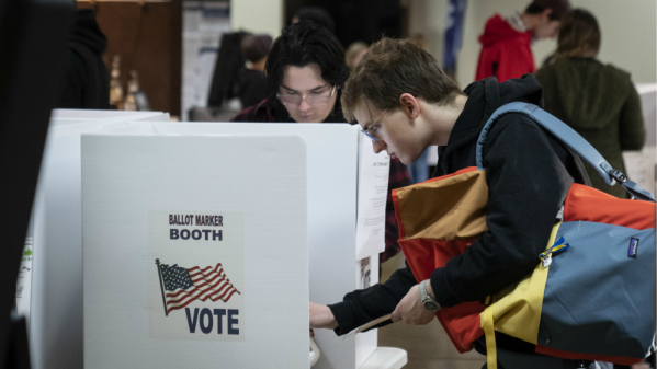 A young person votes in the midterm election at a Church of Christ in Indiana.