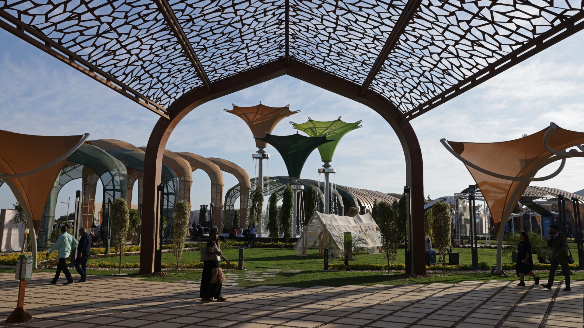 Visitors walk in the Green Zone of the COP27 climate conference on November 10, 2022 in Sharm El Sheikh, Egypt.