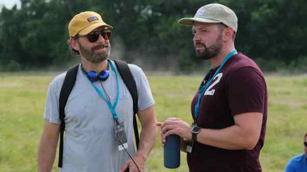 Chosen screenwriters Ryan Swanson, left, and Tyler Thompson on the Texas set for the feeding of the 5,000 scene.