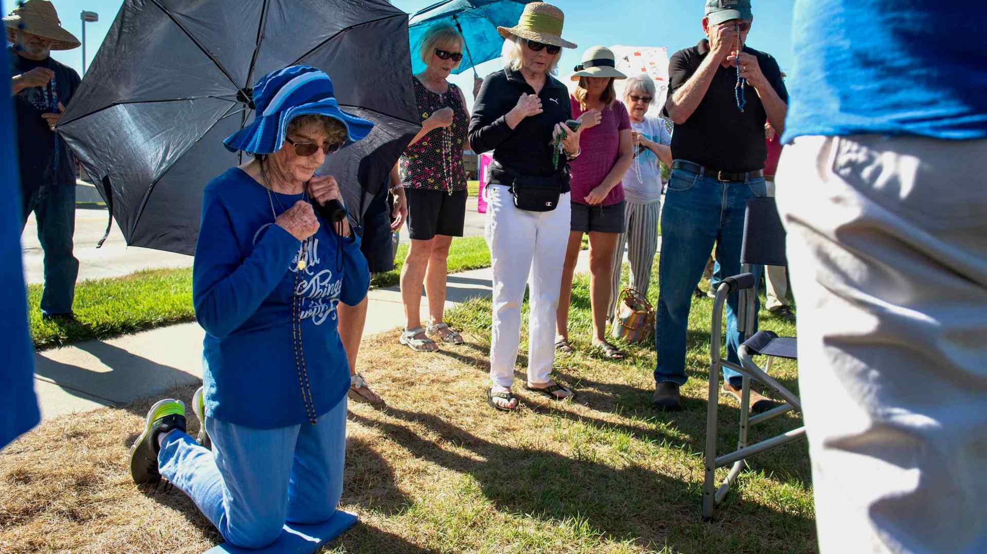 Pro-life demonstrators recite prayers outside of the Planned Parenthood Clinic on Tuesday, Aug. 9, 2022, in Lincoln, Nebraska.