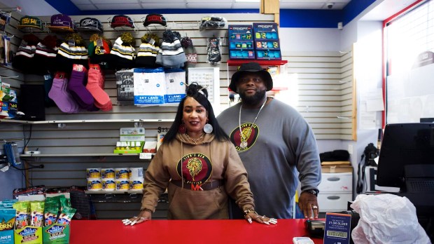 Larry and Sharon Cook at the front counter of The Lion's Den.