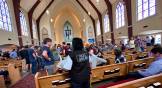 Family members wait for news after a shooting in a Presbyterian Church in America school.