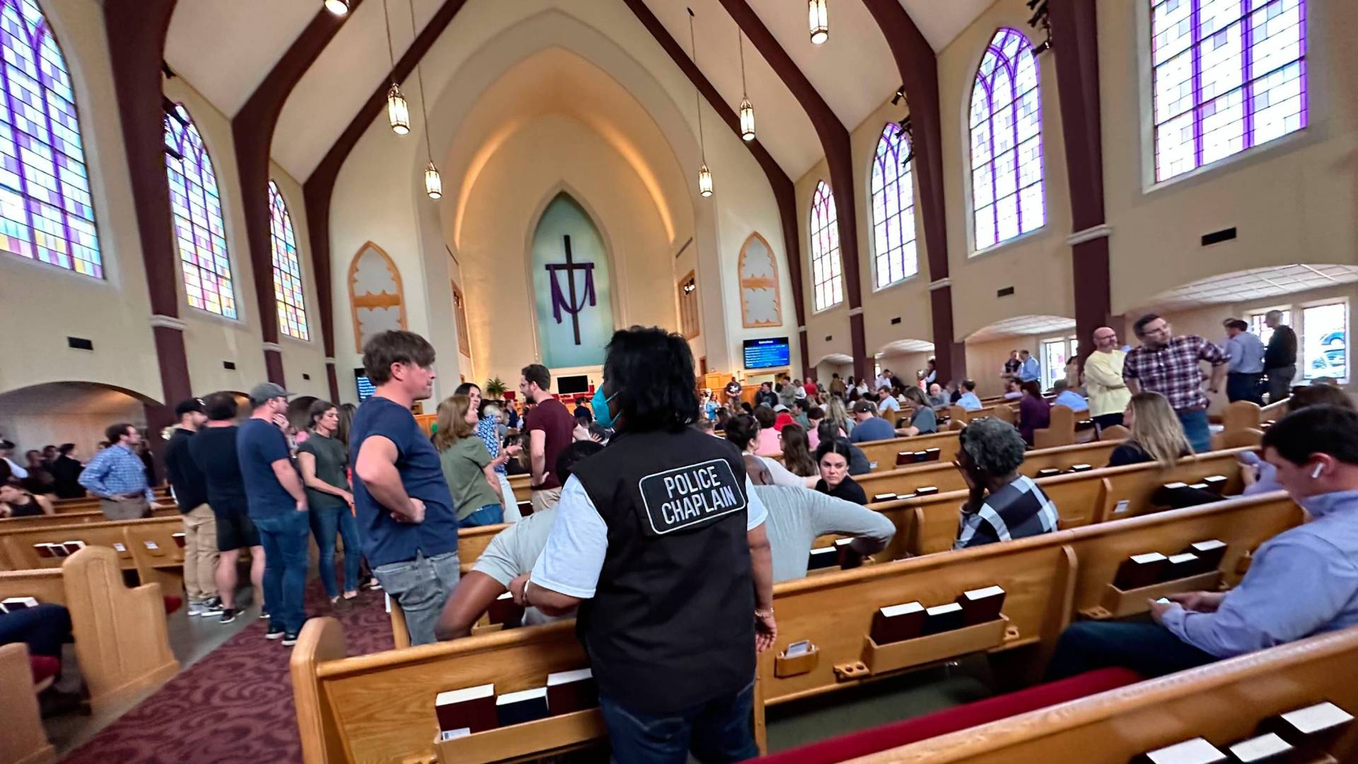 Family members wait for news after a shooting in a Presbyterian Church in America school.