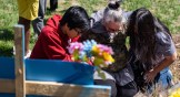 Mourners pray at the entrance of The Covenant School in Nashville, Tennessee.