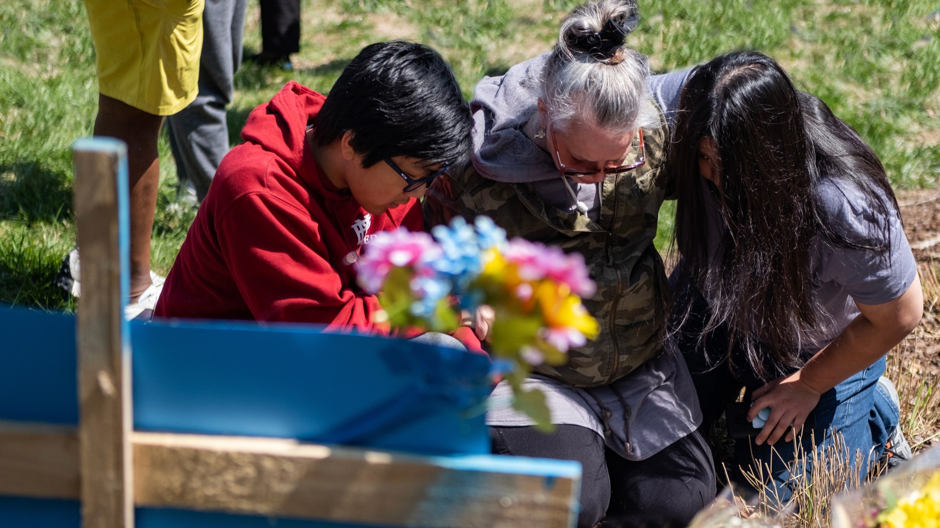 Mourners pray at the entrance of The Covenant School in Nashville, Tennessee.