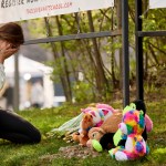 A woman cries as she leaves flowers at the Memorial held at The Covenant School after the shooting in Nashville, Tennessee.