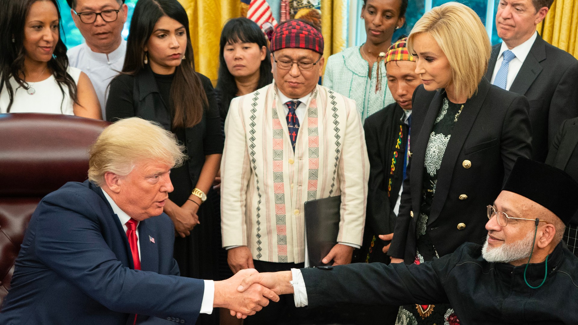 Hkalam Samson (center), a prominent Kachin Baptist leader, and other survivors of religious persecution meeting President Donald Trump in 2019.