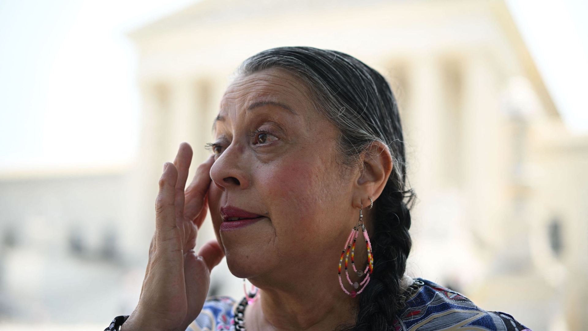 Alabama-Coushatta Tribe of Texas, Tribal Council Vice Chairperson, Nita Battise, wipes away tears outside the US Supreme Court after it upheld the Indian Child Welfare Act.
