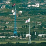Flags of North Korea, rear, and South Korea, front, flutter in the wind as pictured from the border area between two Koreas.