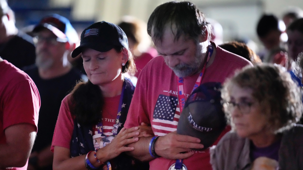 Trump supporters pray at a campaign rally in New Hampshire.