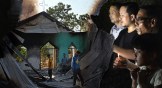 Left: Villagers inspect the debris of a ransacked church that was set on fire by a mob in Manipur. Right: Manipuri pray for peace.