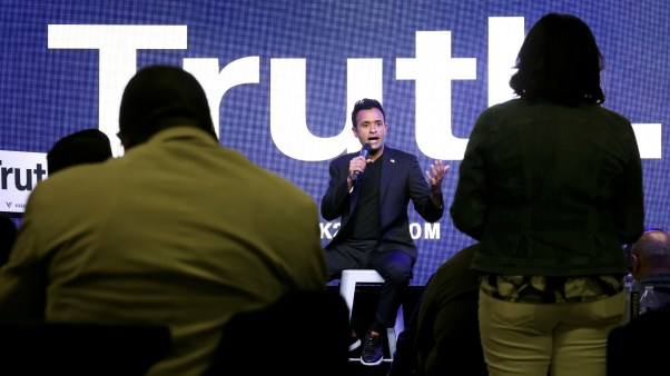Republican presidential candidate Vivek Ramaswamy speaks to residents during a town hall meeting.