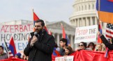 A religious official leads a prayer during a protest organized by the Armenian National Committee of America outside of the U.S. Capitol.