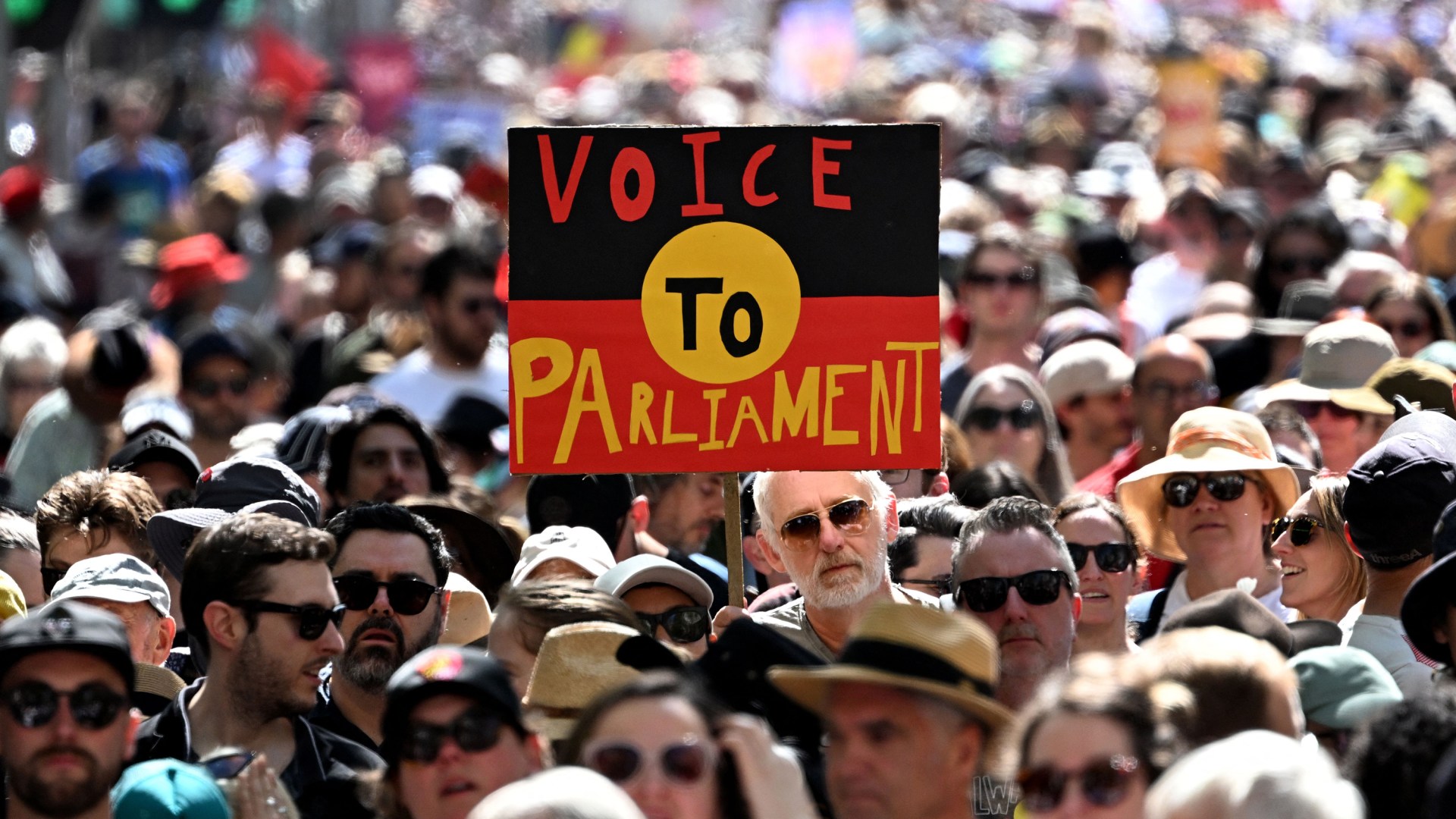 A sign of the Australian Aboriginal Flag referencing the 2023 Australian Indigenous Voice referendum.
