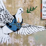 ‘The Armed Dove’ street art by Banksy near the Israeli separation West Bank Wall in Bethlehem.