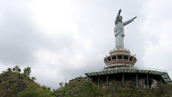 The statue of Jesus Christ Blessing at the Peak of Buntu Burake in Indonesia.