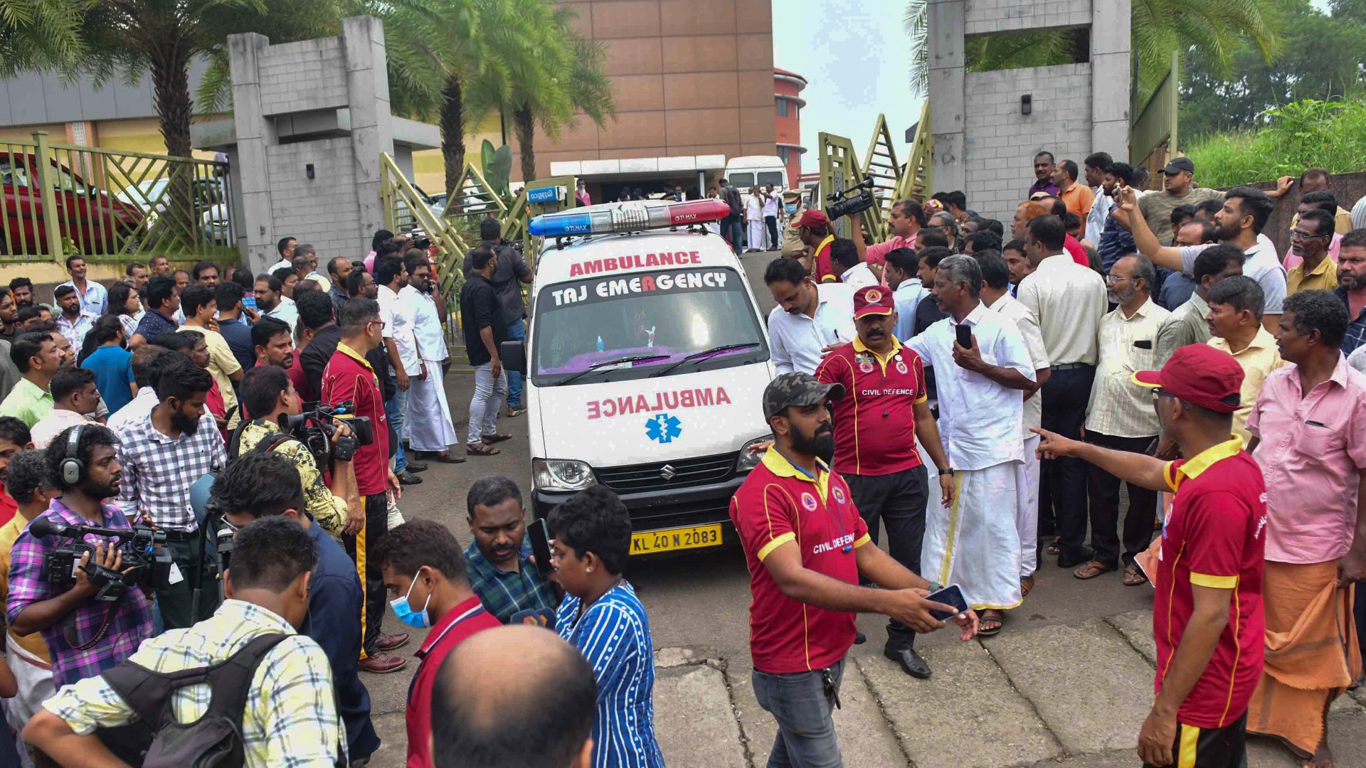 An ambulance leaves the Zamra International Convention Center after an explosive device blew up during a prayer session of Jehovah's Witness faithful.