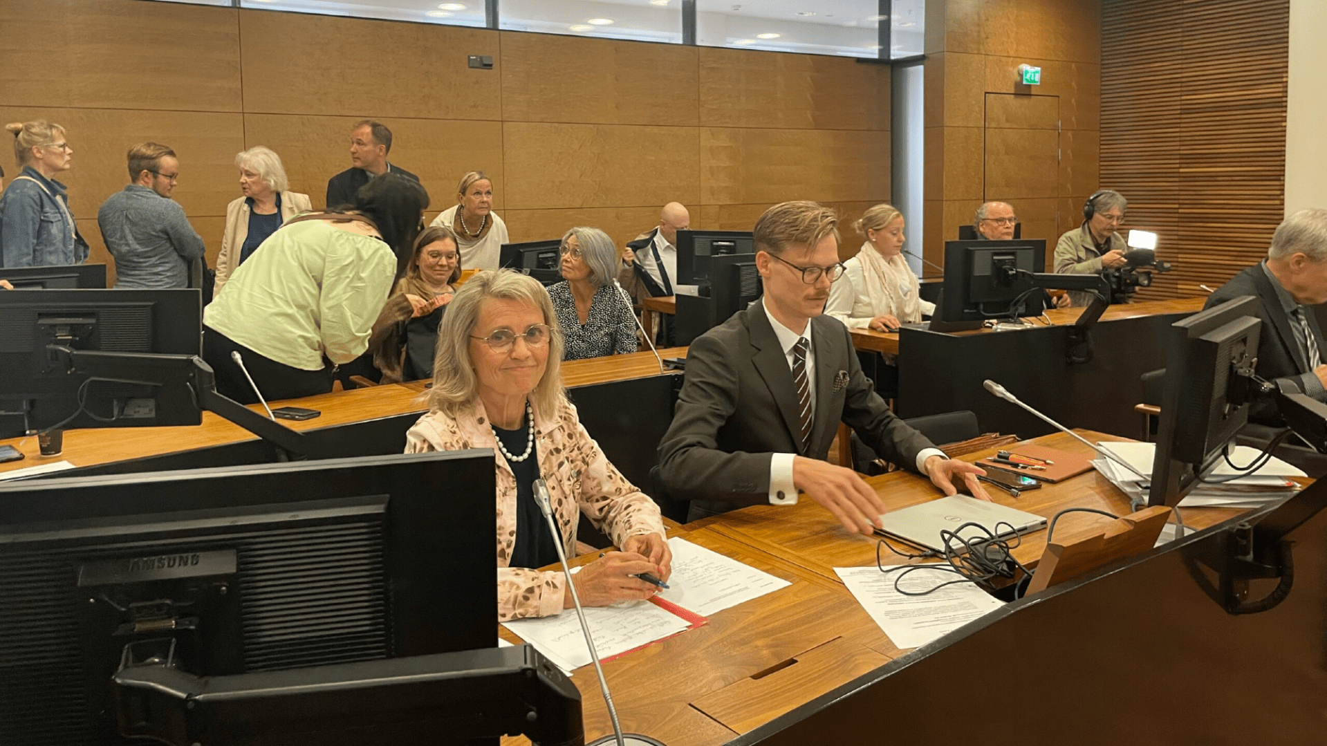 Päivi Räsänen and her lawyer Matt Sankamo in a Finnish courtroom facing hate speech charges.