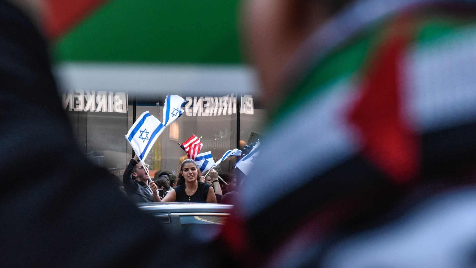 Pro-Israel activists and Pro-Palestinian activists at a rally.