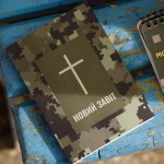 A New Testament and warrior's prayer book lie on the table at a stabilization point on October 20, 2023 in Donetsk Oblast, Ukraine.