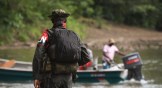 Rebels of the National Liberation Army patrol near the Baudo river in Colombia.