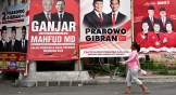 Billboard of two pairs of candidates and other legislative candidates running in Indonesia's upcoming general election. 