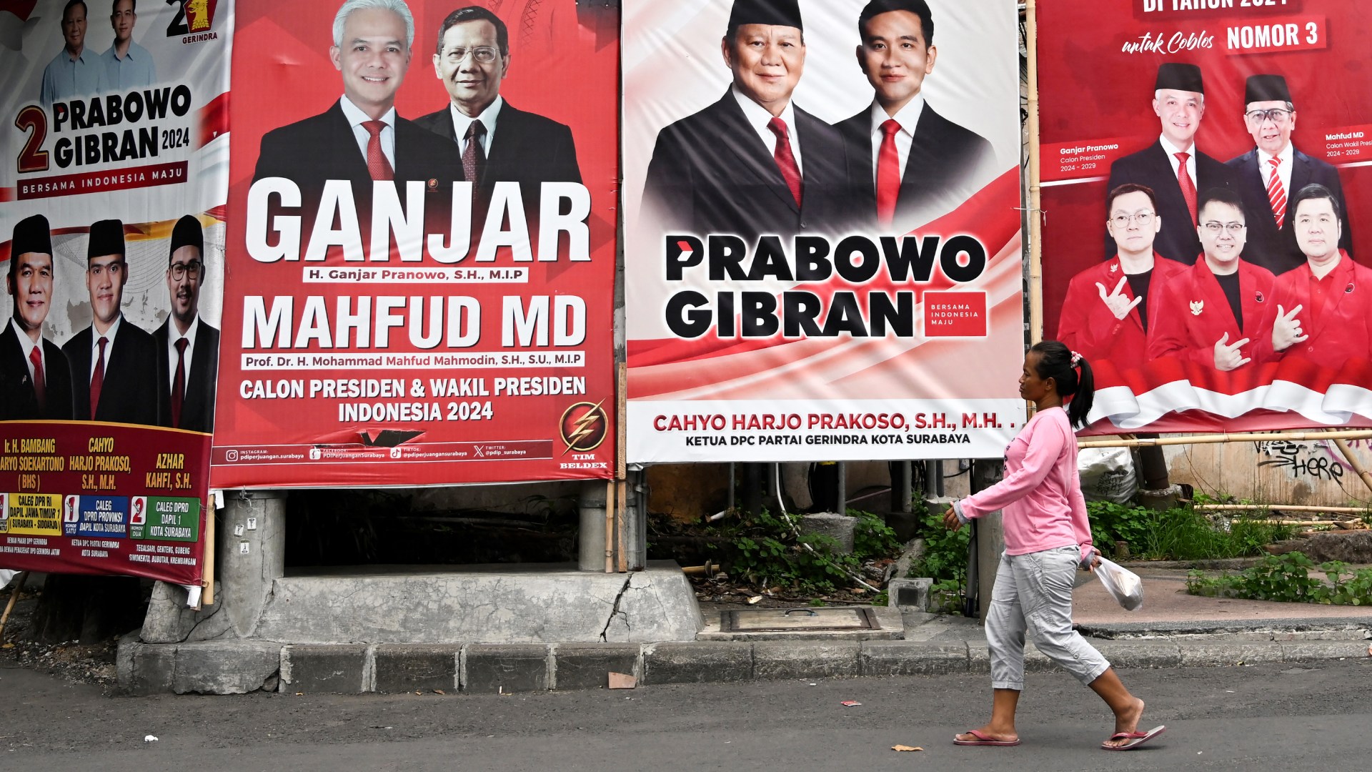 Billboard of two pairs of candidates and other legislative candidates running in Indonesia's upcoming general election. 