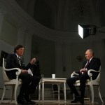 Russian President Vladimir Putin gives an interview to US talk show host Tucker Carlson at the Kremlin in Moscow on February 6, 2024, in this pool photograph distributed by Russian state agency Sputnik.