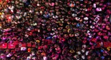 A crowd celebrating during a Carnival street party in Brazil.