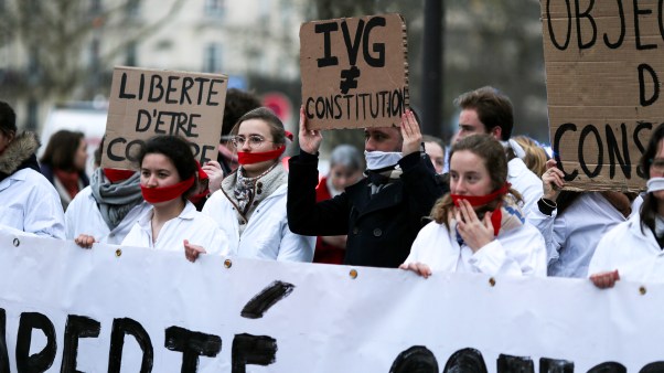 Protestors taking part in a silent pro-life demonstration in Paris as the Senate begins debates on the inclusion of abortion in the constitution.