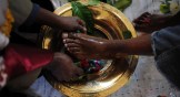 An Ethiopian Orthodox Church leader in Denver, Colorado washes feet as part of a Maundy Thursday service.