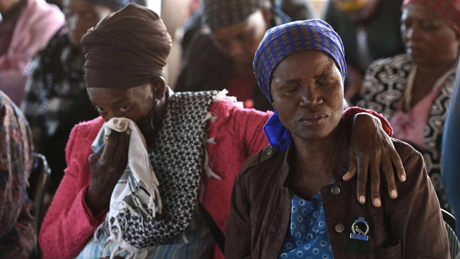Relatives of the victims of a bus accident mourn at the Zion Christian Church (ZCC) in Molepolole, Botswana.