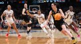 Iowa's Caitlin Clark dribbles in the women's college basketball championship against South Carolina. The game drew record-breaking bets.
