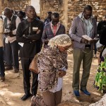 Catholics pray during a Good Friday service outside of St. Charles church in Senegal on March 29, 2024.