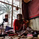 Gogo Kamo, a sangoma in Kempton Park, South Africa, uses bones, herbs, and the Bible to interpret a reading with an online client.