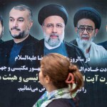 A woman passes by a poster of Iran's late president Ebrahim Raisi who died in a helicopter crash.